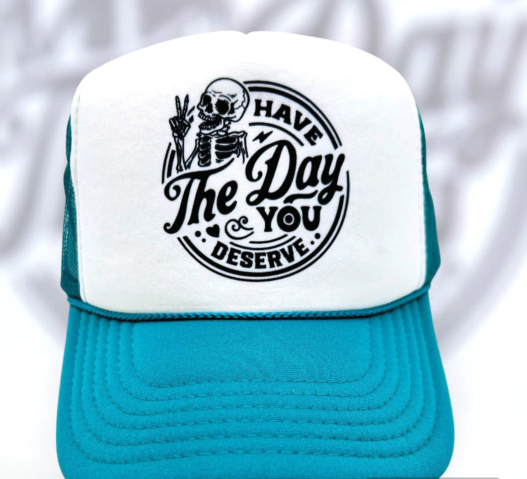 Have the day you deserve!  Teal/white trucker hat with black sublimation print which means the ink is in the cap! No hand feel, wont crack, peel, or fade.
